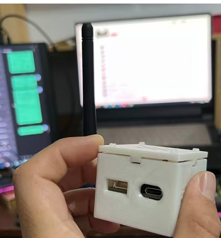 The prototype held in a hand, USB-C and USB ports visible on its side